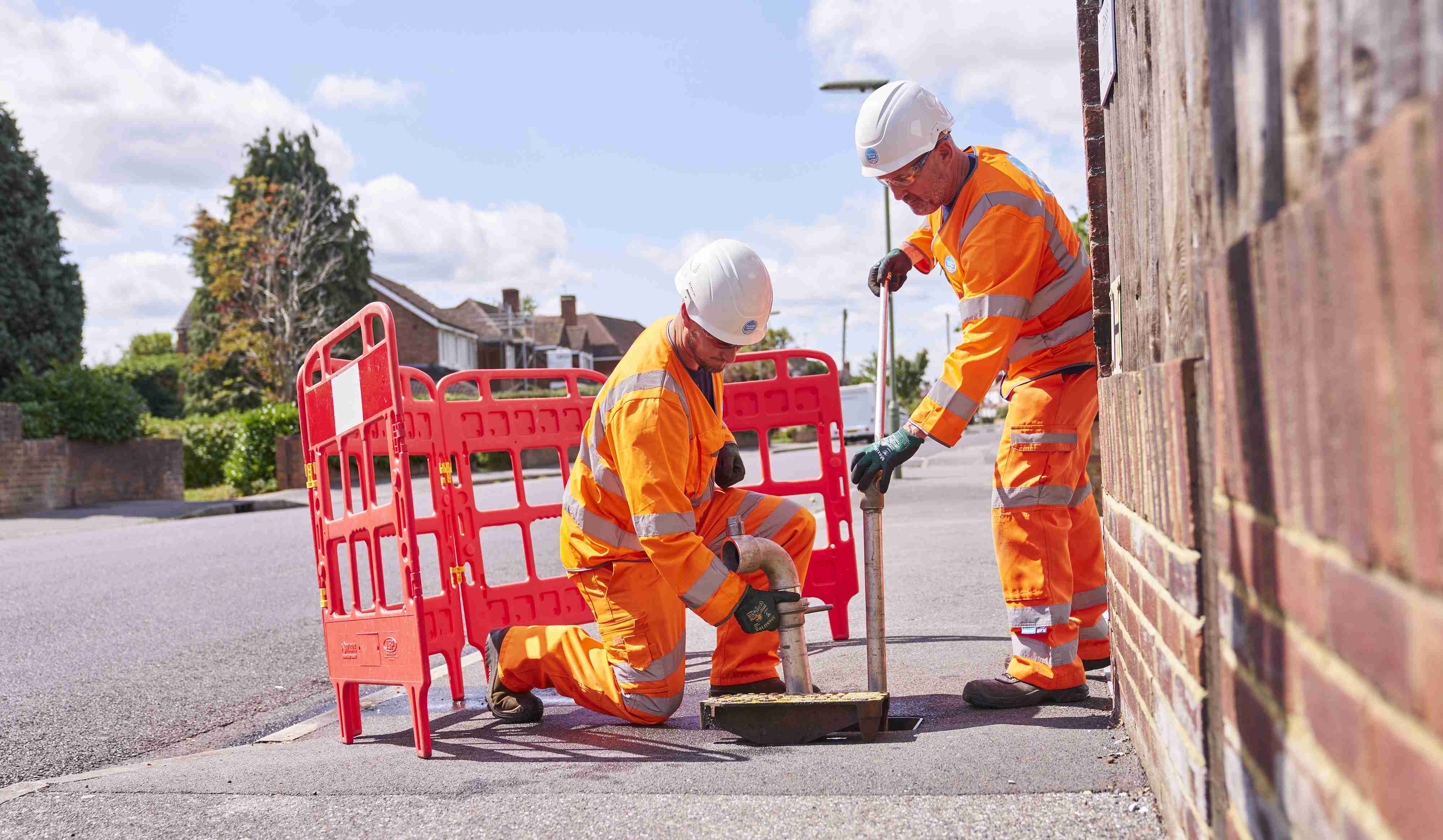 engineers fixing pipe