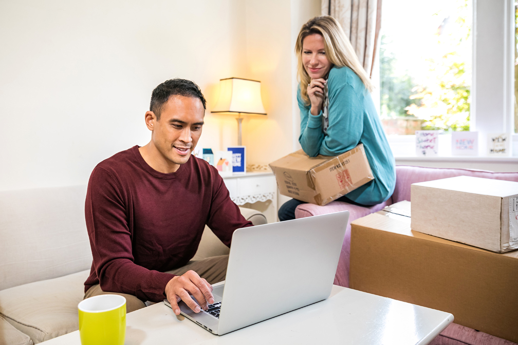 Couple looking at a laptop screen