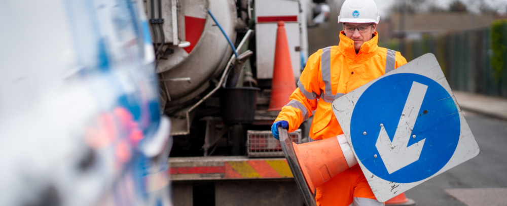 Thames Water engineer setting up traffic management