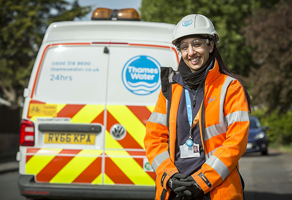 Image of a Thames Water worker standing by a van