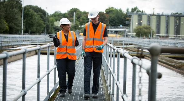 two members of thames water staff on site