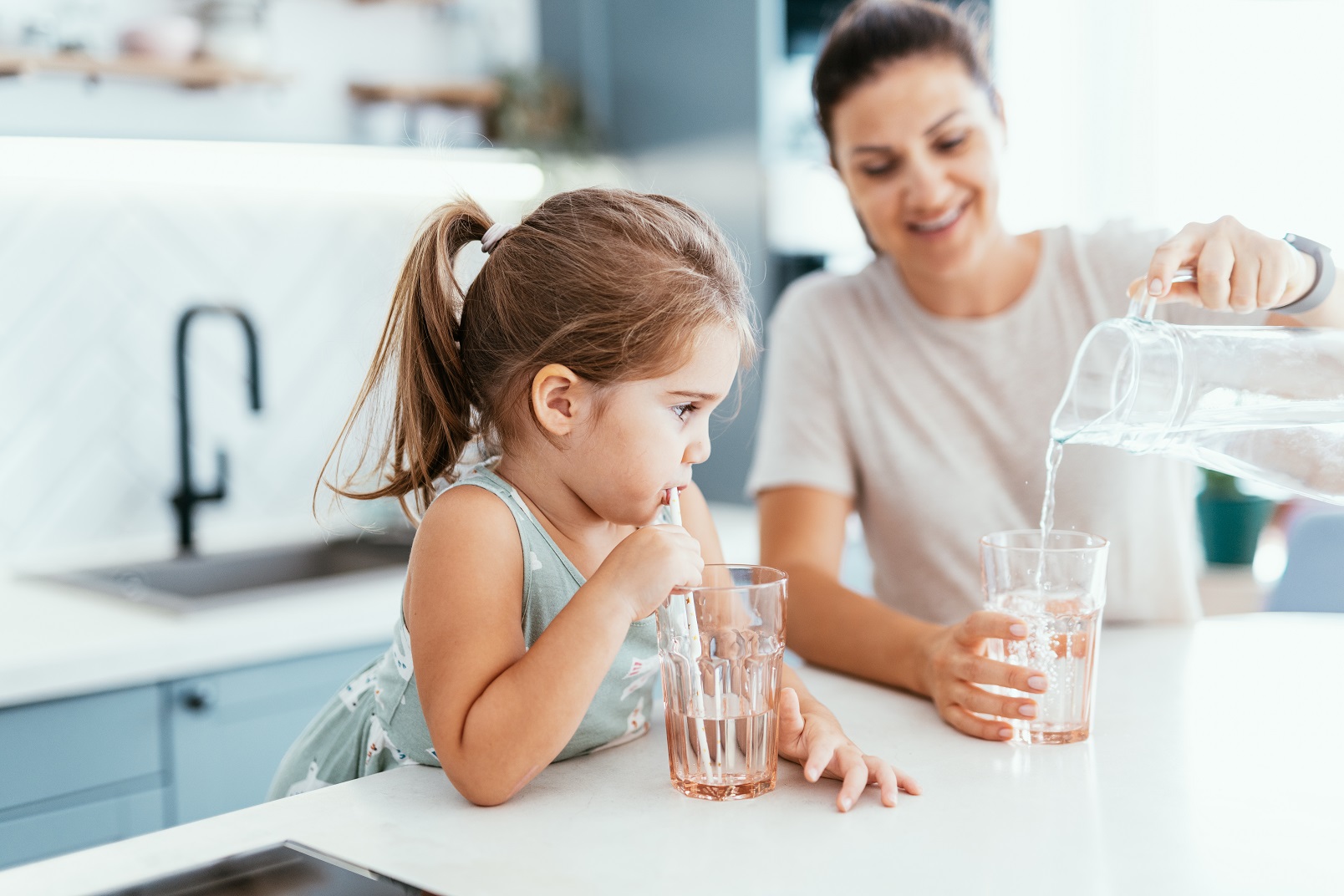 Family pouring and drinking water