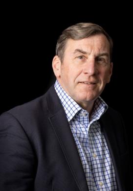 A headshot photo of Andrew McNaughton