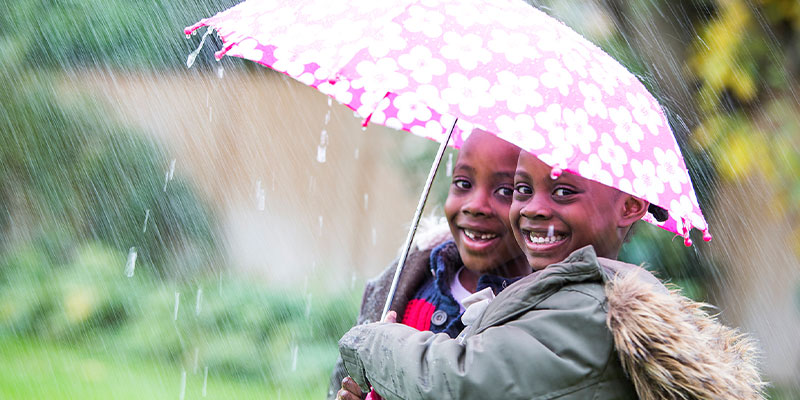Children under umbrella